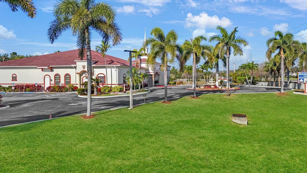 This stunning 8, 644 SF building is situated on a meticulously landscaped 4.