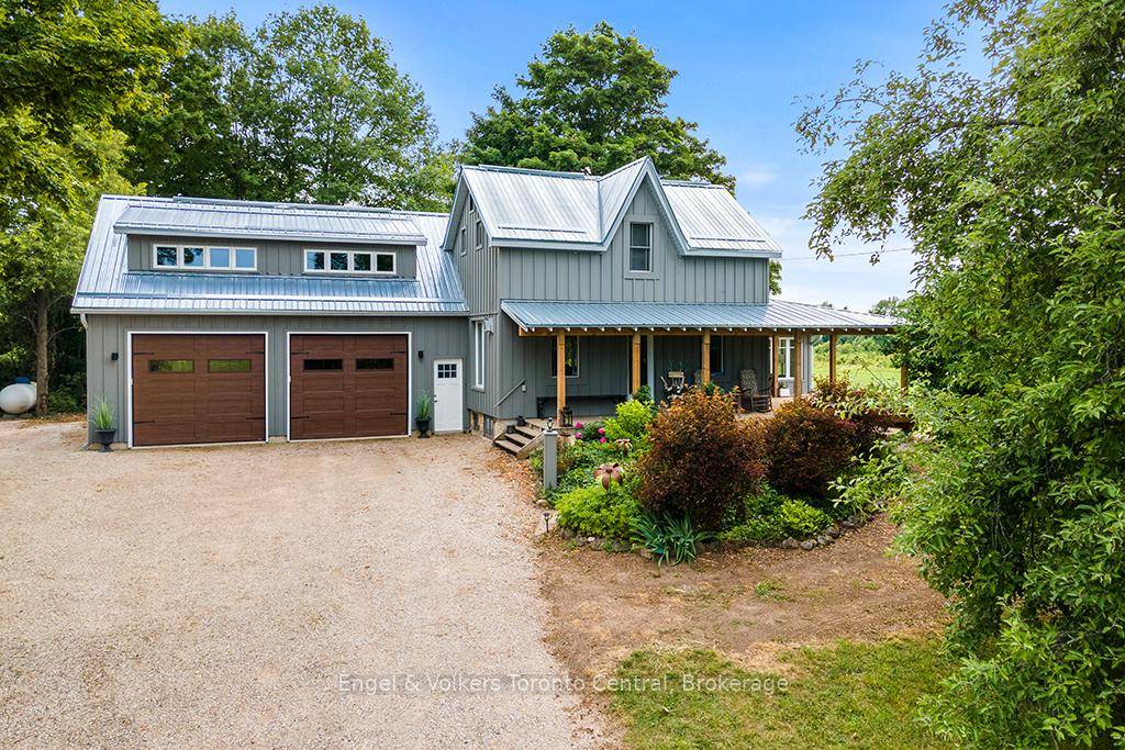 Embrace the peaceful country life in this beautifully updated farmhouse, set on a sprawling 53 acre property accessed via a quiet paved road.
