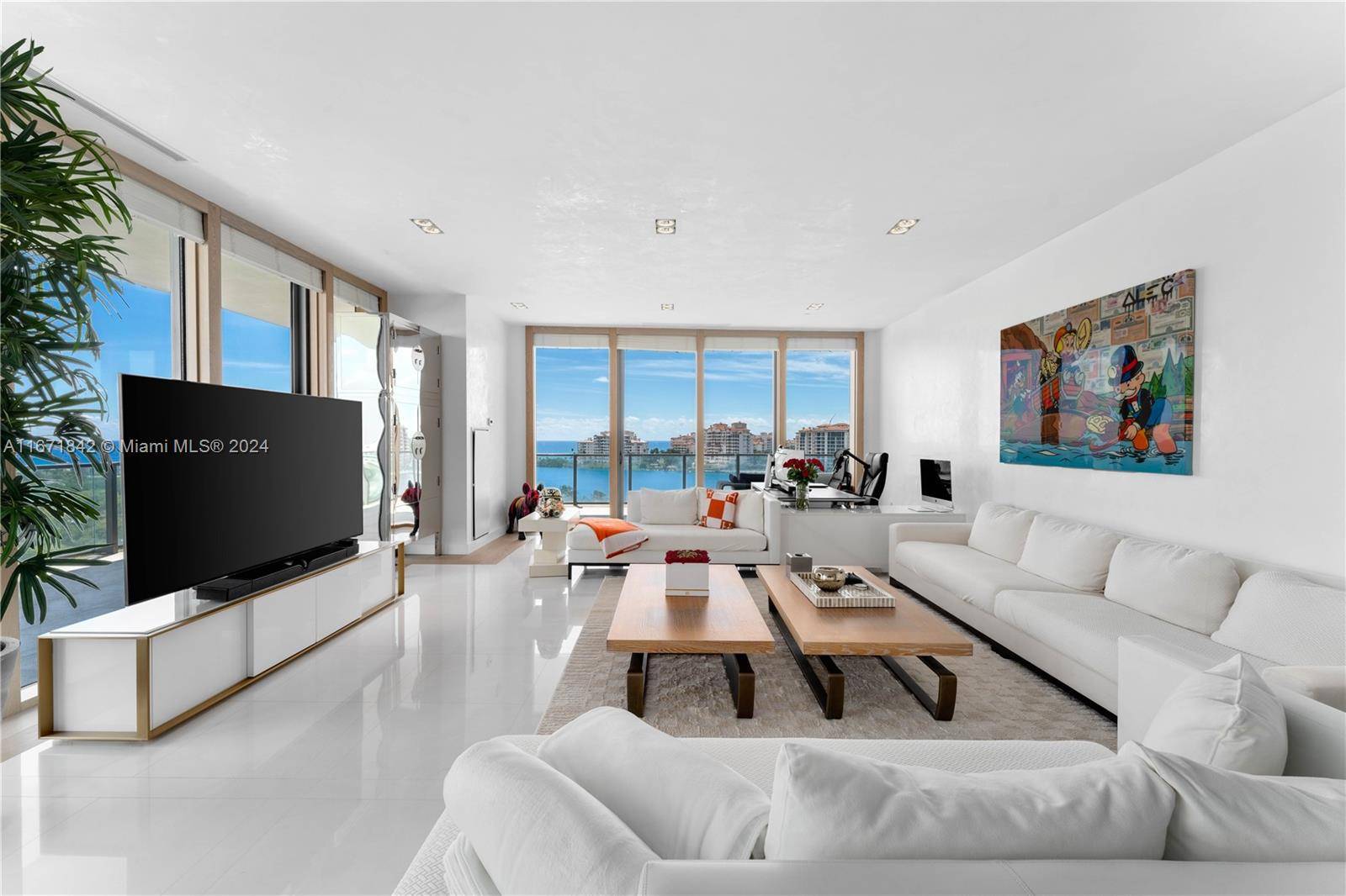 Crafted by the acclaimed designer Luis Bustamante, this turnkey residence at the prestigious Apogee presents a sophisticated living experience with sweeping views of the ocean, Fisher Island, and the city ...