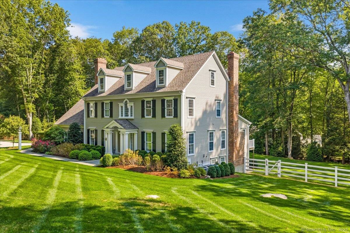 A traditional Colonial set on a quiet, tree lined street, completely updated and refreshed with understated elegance throughout.