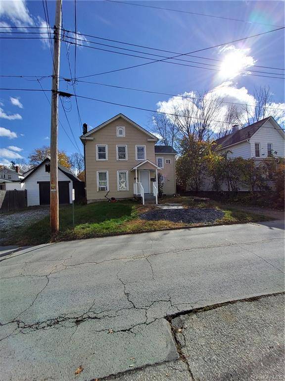 Nice Two family house on a quiet street, has a huge detached garage.