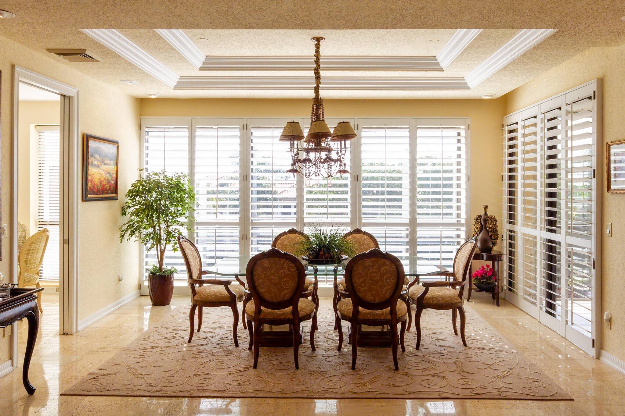 Welcome to 7383 Orangewood Lane, Unit 103 a rare offering in the exclusive Chateau building of the prestigious Boca Grove Country Club.