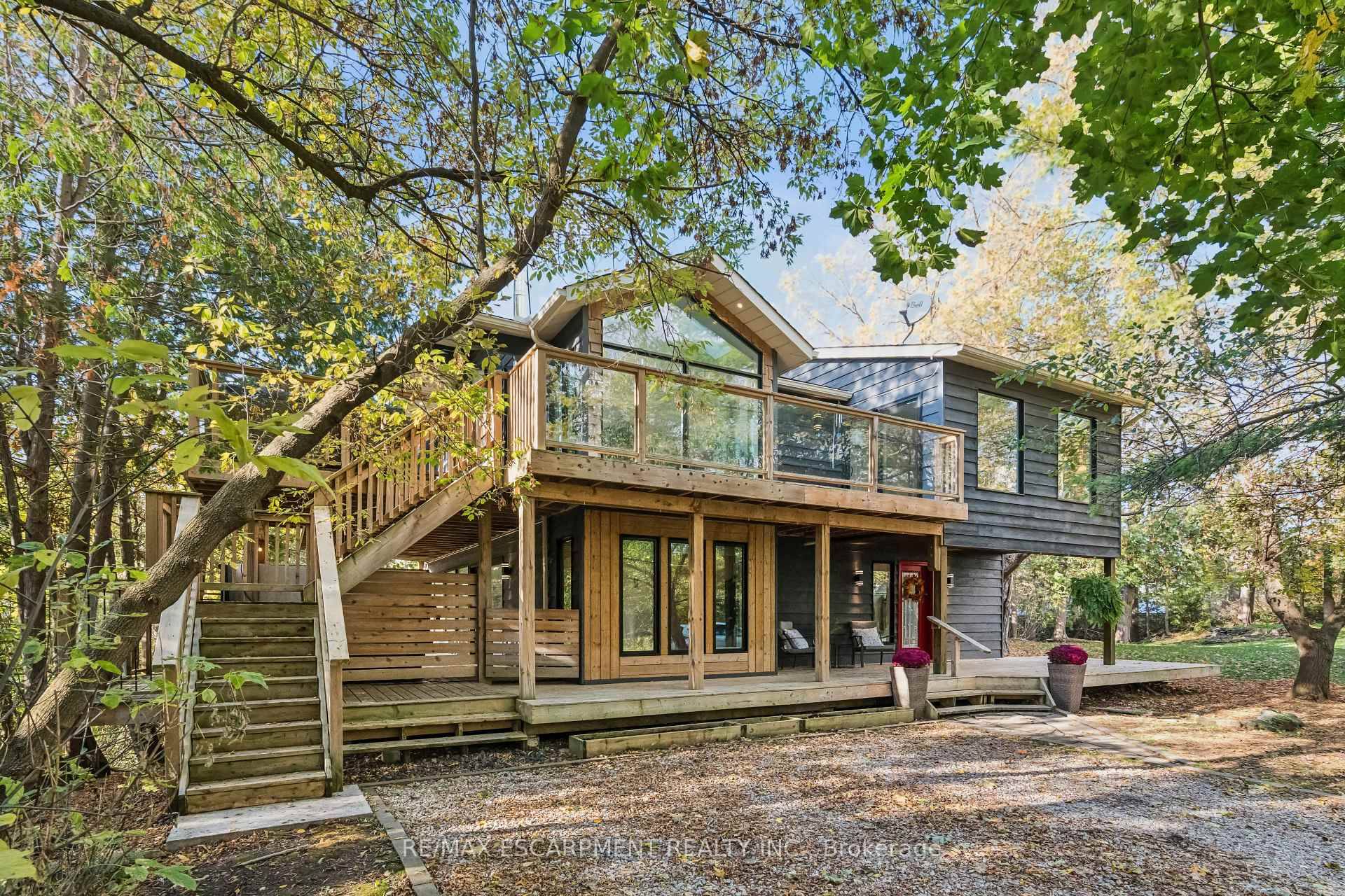 Tucked away off a quiet road and overlooking the forested beauty of Rockwood Conservation Area, 118 Old Quarry Road offers refined, nature connected living with modern design sensibility.