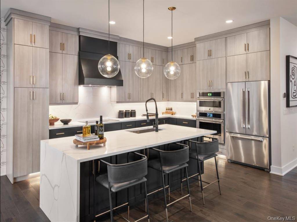 The elegantly appointed Winwood opens with a stylish foyer boasting a tray ceiling and a bright flex room.