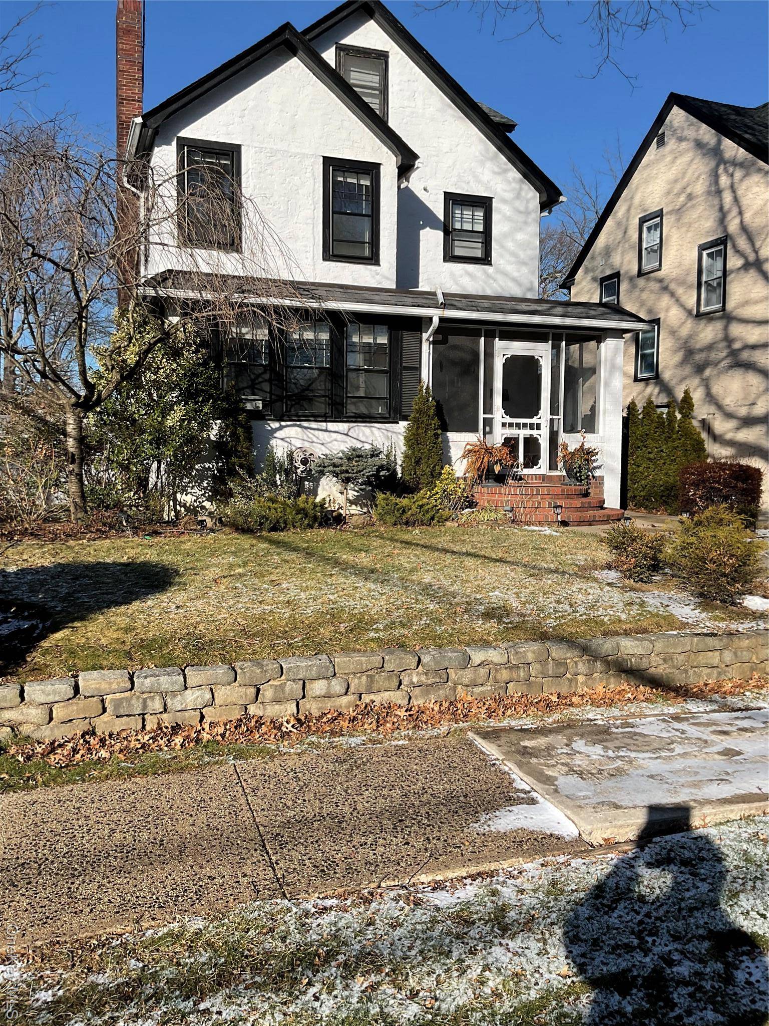 Classic Colonial in mint condition featuring an inviting entrance hall, a spacious living room with a fireplace, and a cozy front den.