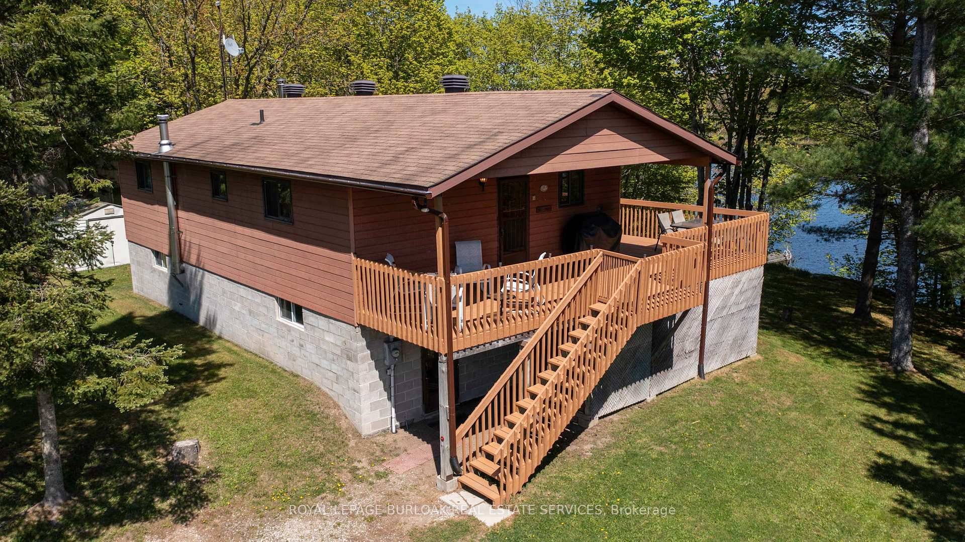 Welcome to this beautifully maintained 2 storey, 4 bedroom, all season home, offering year round comfort and breathtaking views nestled in a quiet Bay on Manitouwabing Lake.