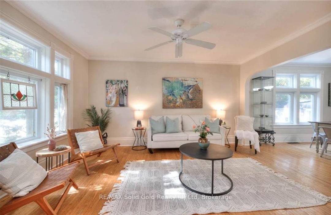 Set on a lush 60 x 144 foot lot, this century home offers serenity with the lively rhythm of its surroundings.