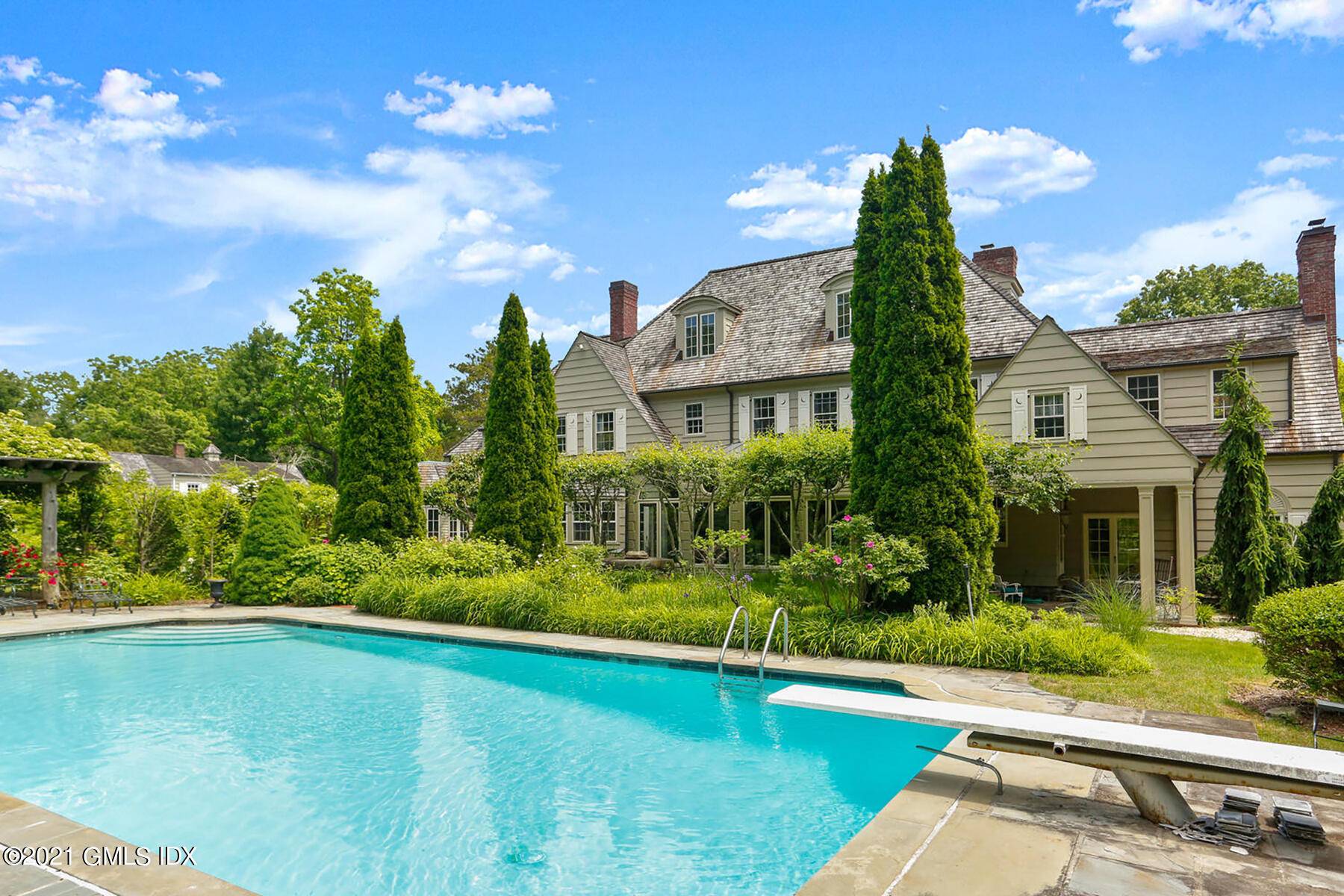 This beautiful country estate with pool and cottage is hidden from view off midcountry Lake Avenue.
