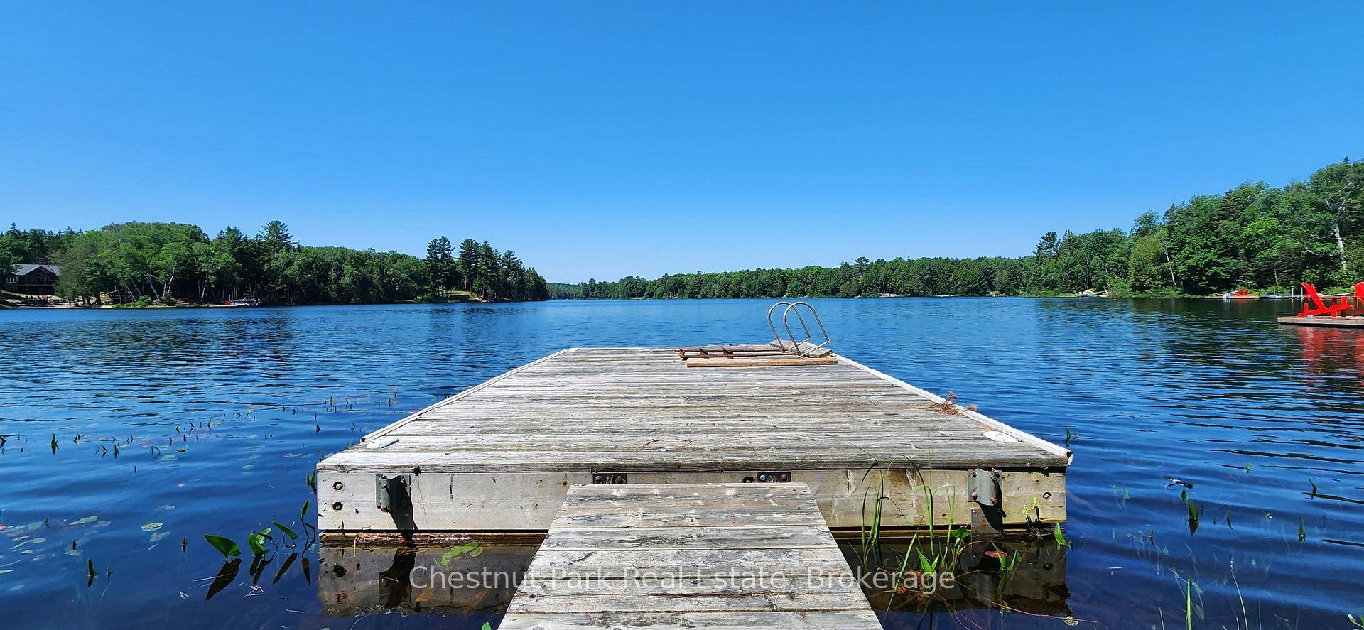 Enjoy this west facing waterfront lot, which includes a level building backlot with lake views !