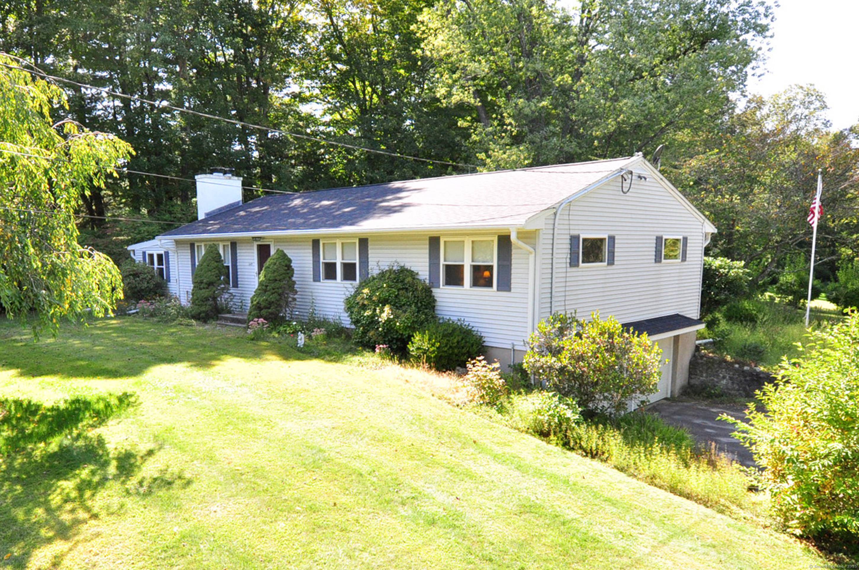 Charming one level living in a beautiful setting.