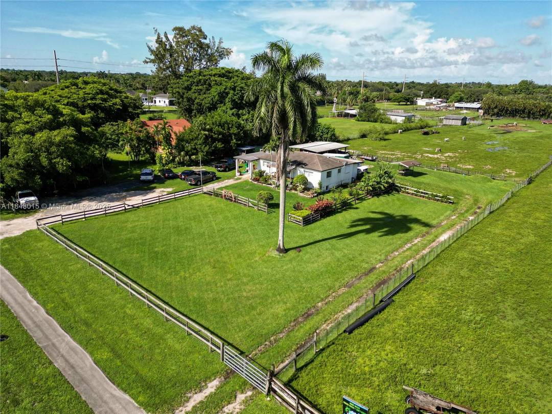 Set on a builder's acre lot in the heart of Davie.