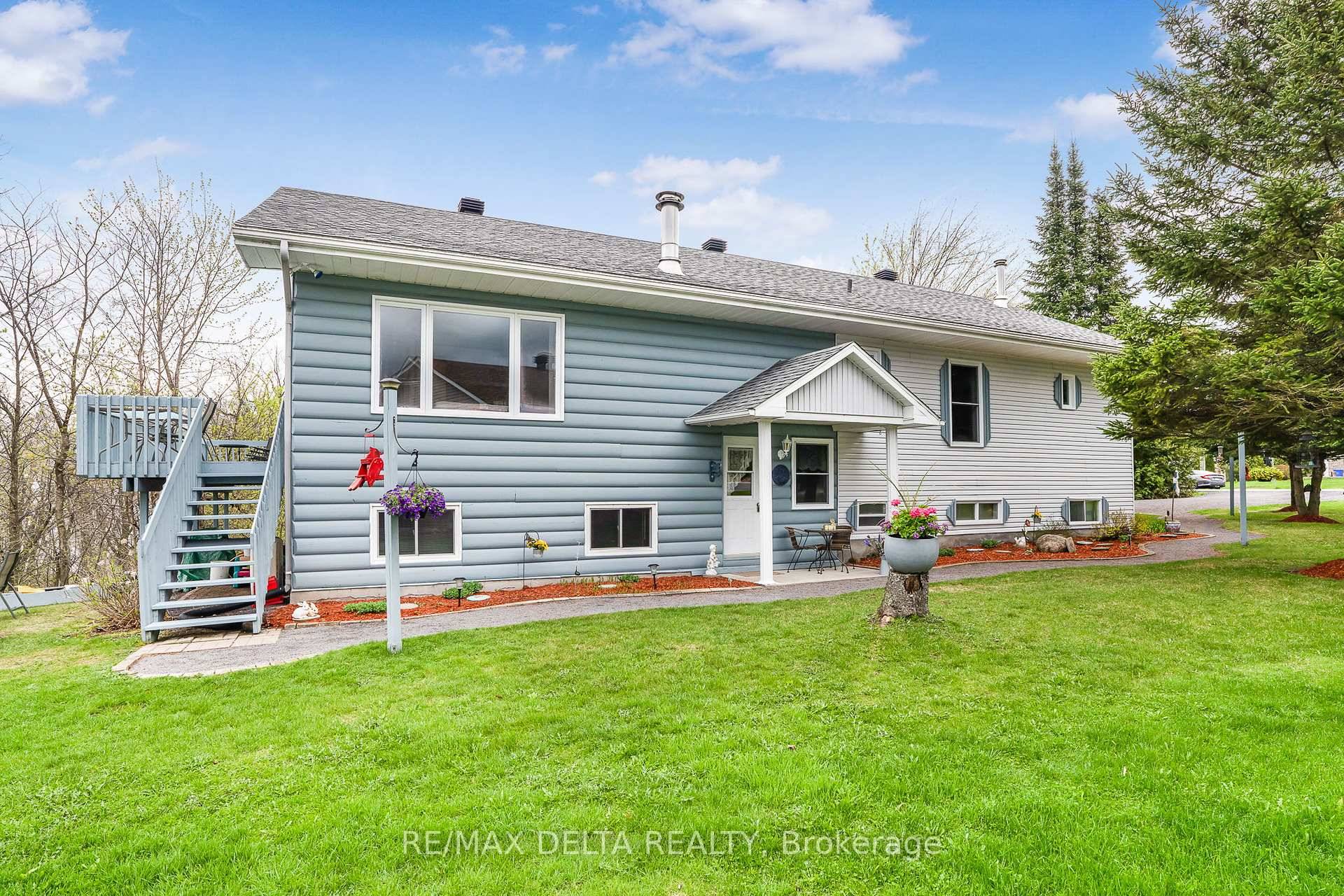 Welcome to this exceptional approx 1800 sq ft walk out hi ranch bungalow in Wendover, offering stunning river views and deeded water access.