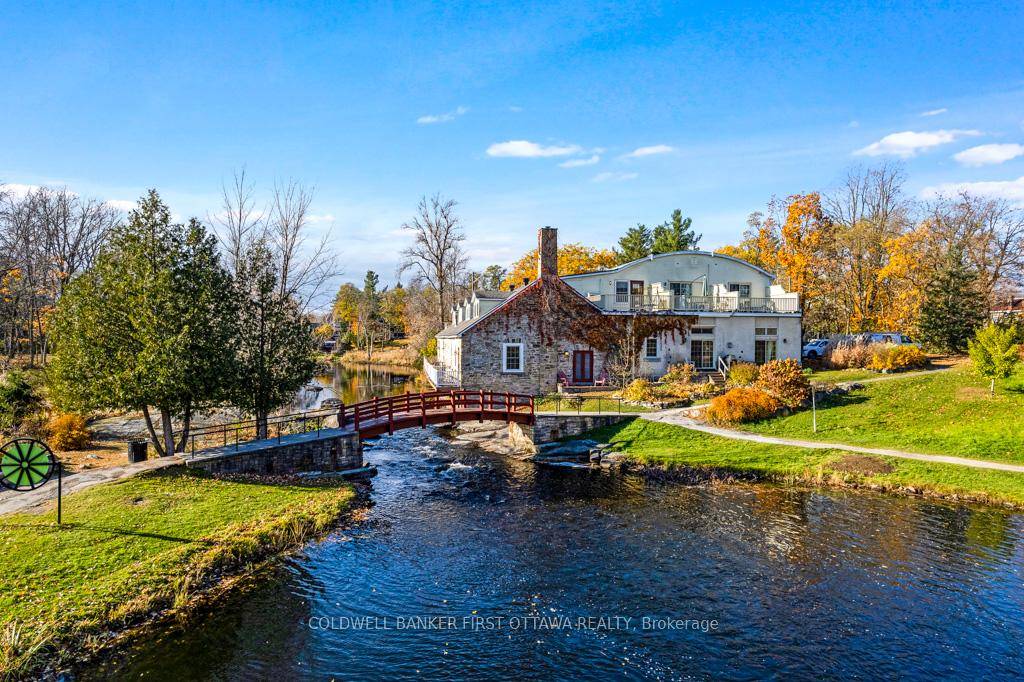 Surrounded by serenity on the Tay River beside majestic treed park, in the heart of picturesque Perth.