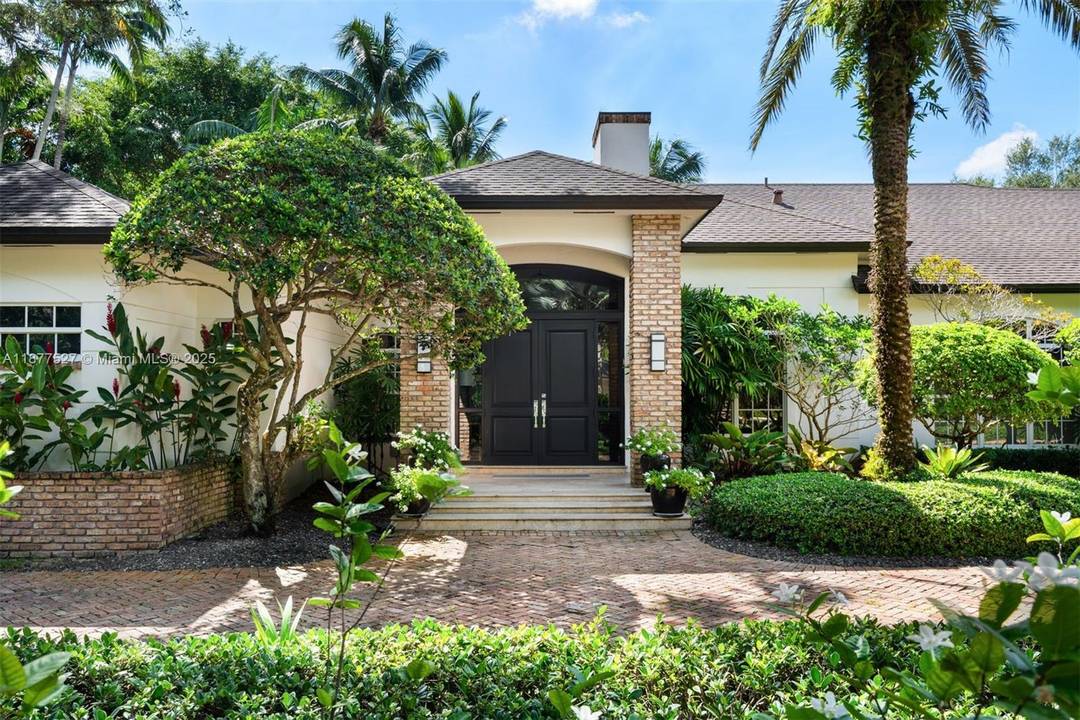 Nestled on a quiet cul de sac in prestigious North Pinecrest, this stunning estate offers 6 BD, 6.