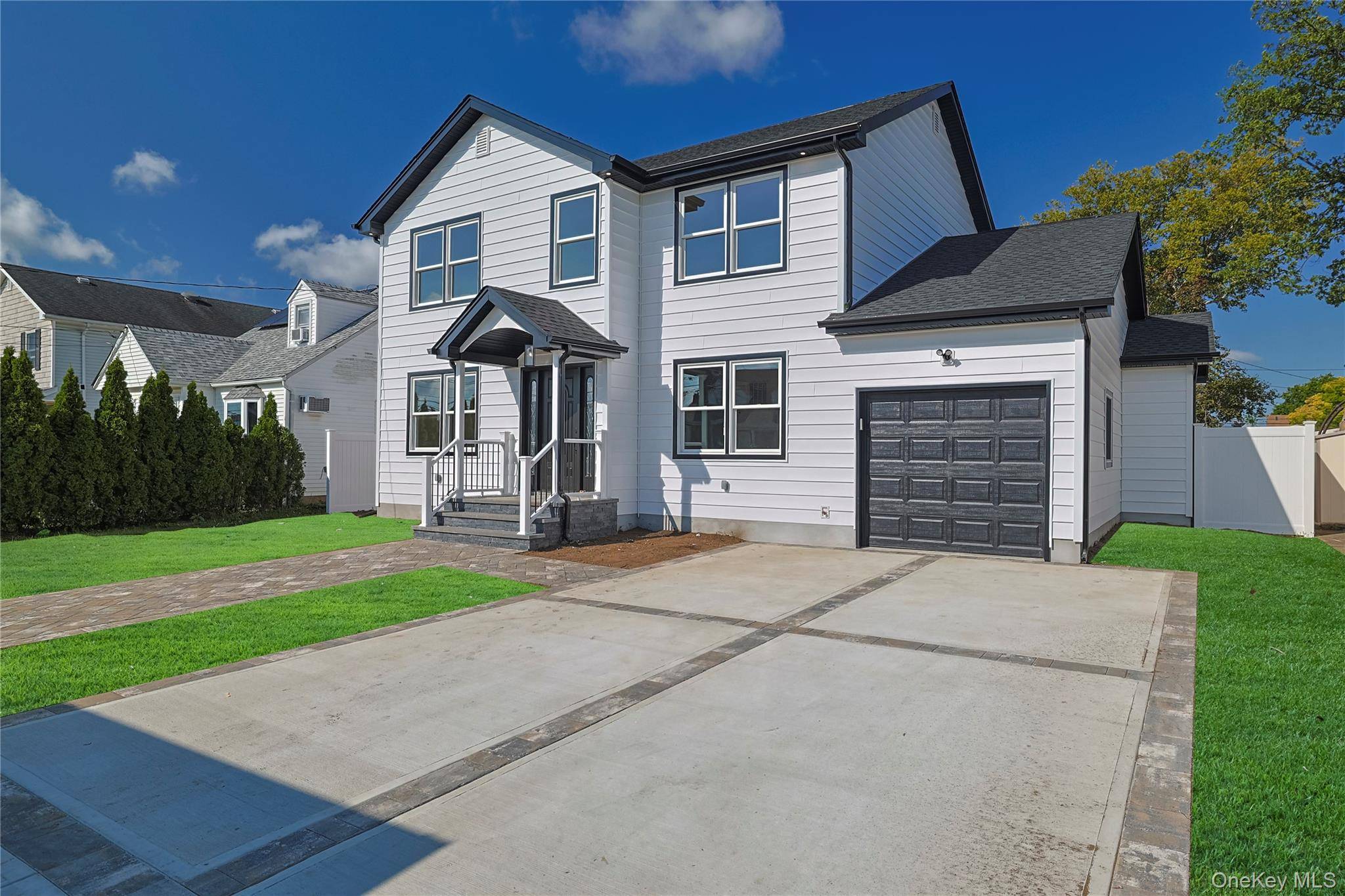 Welcome to this stunning colonial nestled in the heart of West Hempstead, where modern luxury meets timeless charm.