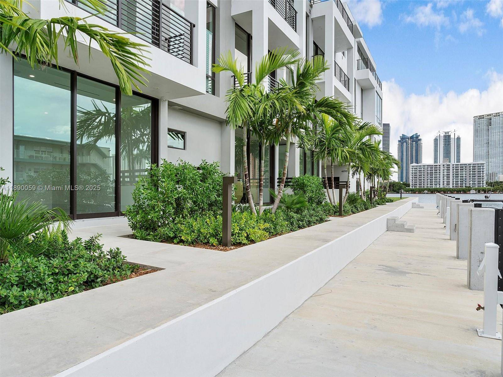 Experience brand new construction in the epitome of elegance from this magnificent waterfront townhome with dock.