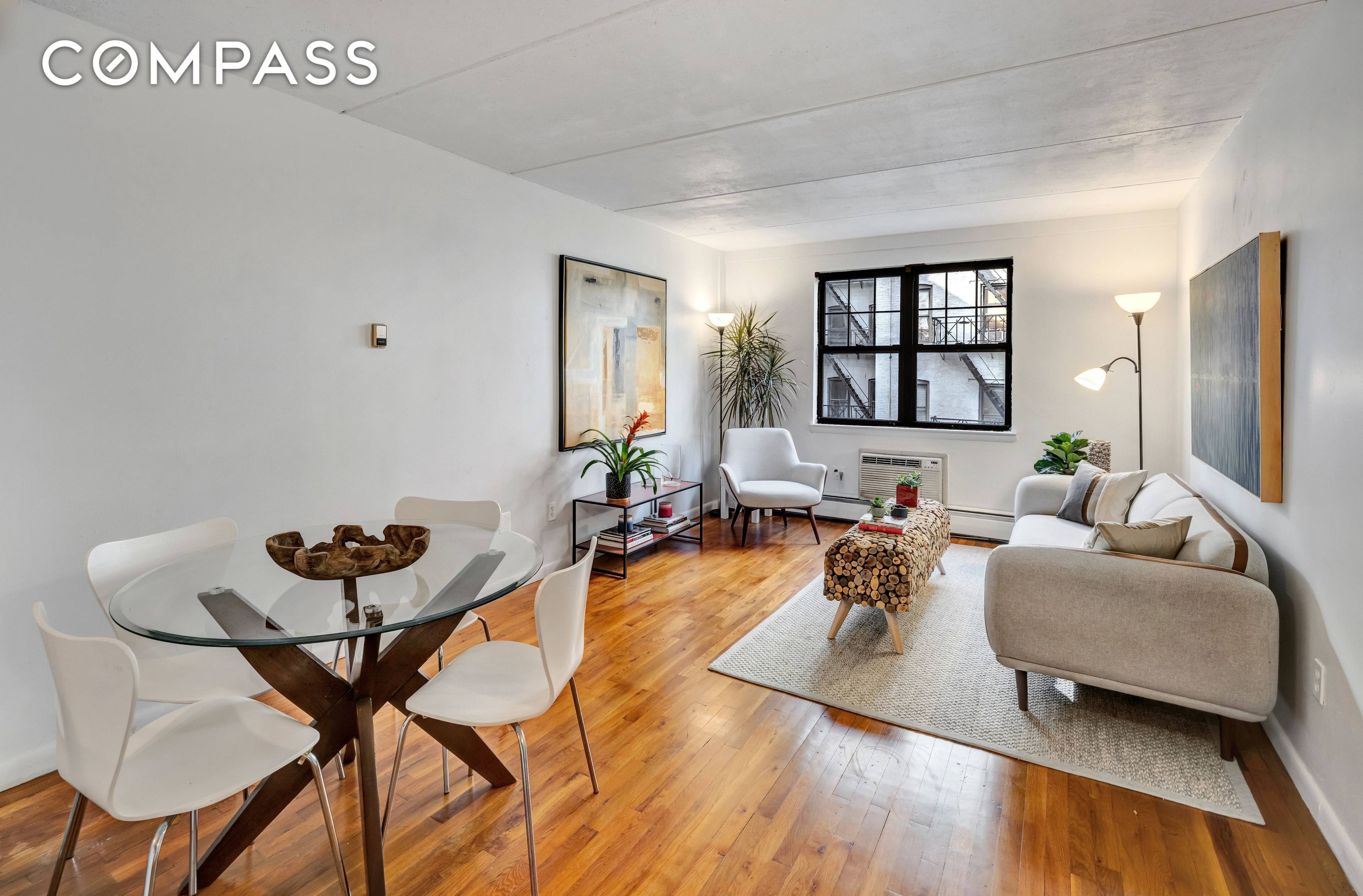 Welcome to 511 East 11th Street, a charming townhouse style condo offering modern style and cozy comfort.