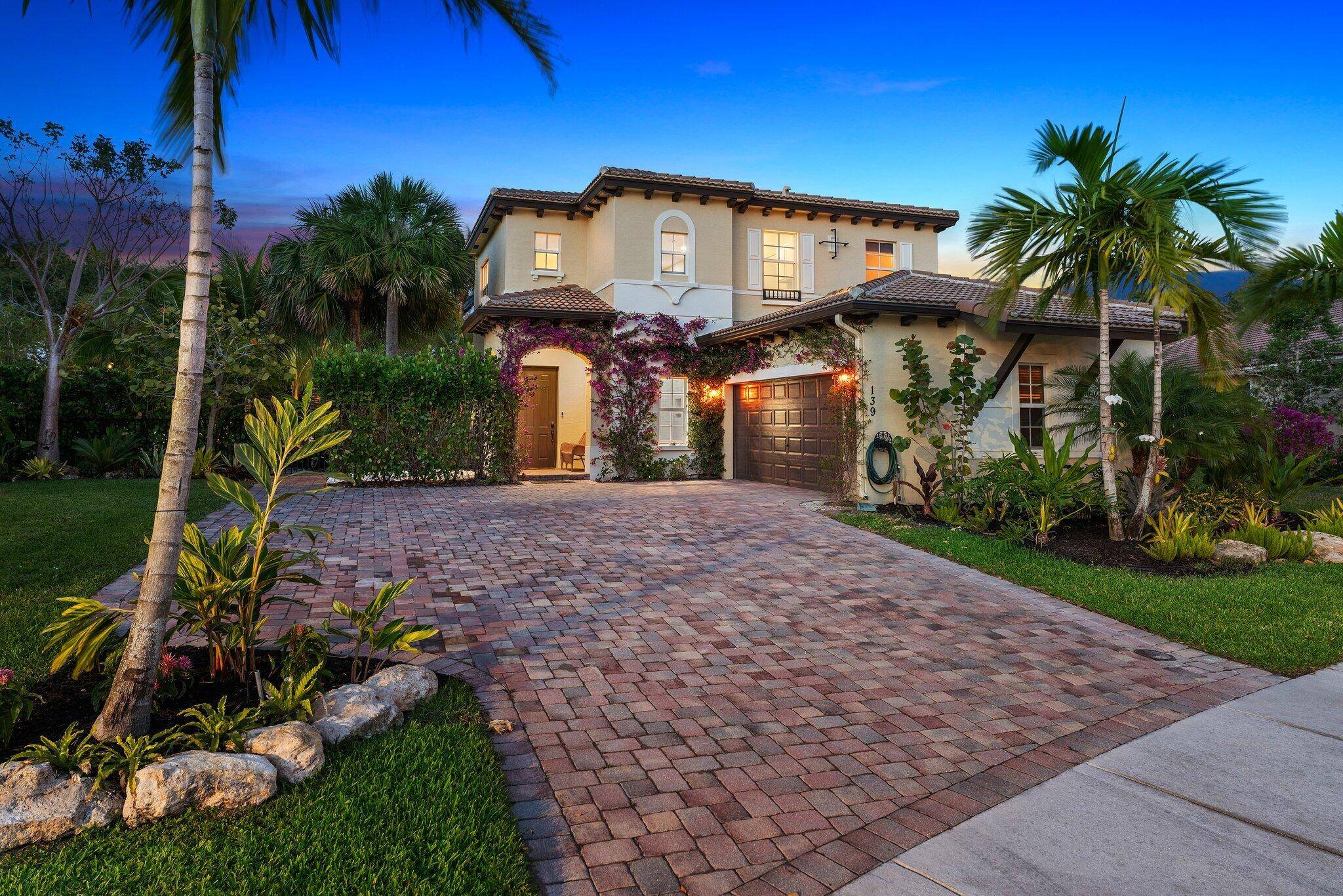 Welcome to your dream home in the highly sought after gated community of Rialto, nestled in the charming town of Jupiter.