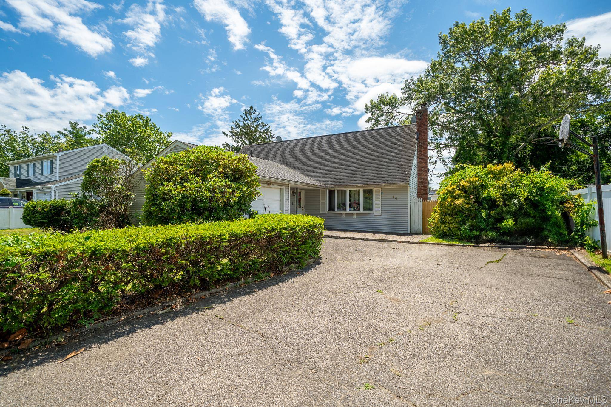Welcome to 14 Arcadia Drive in desirable Dix Hills !