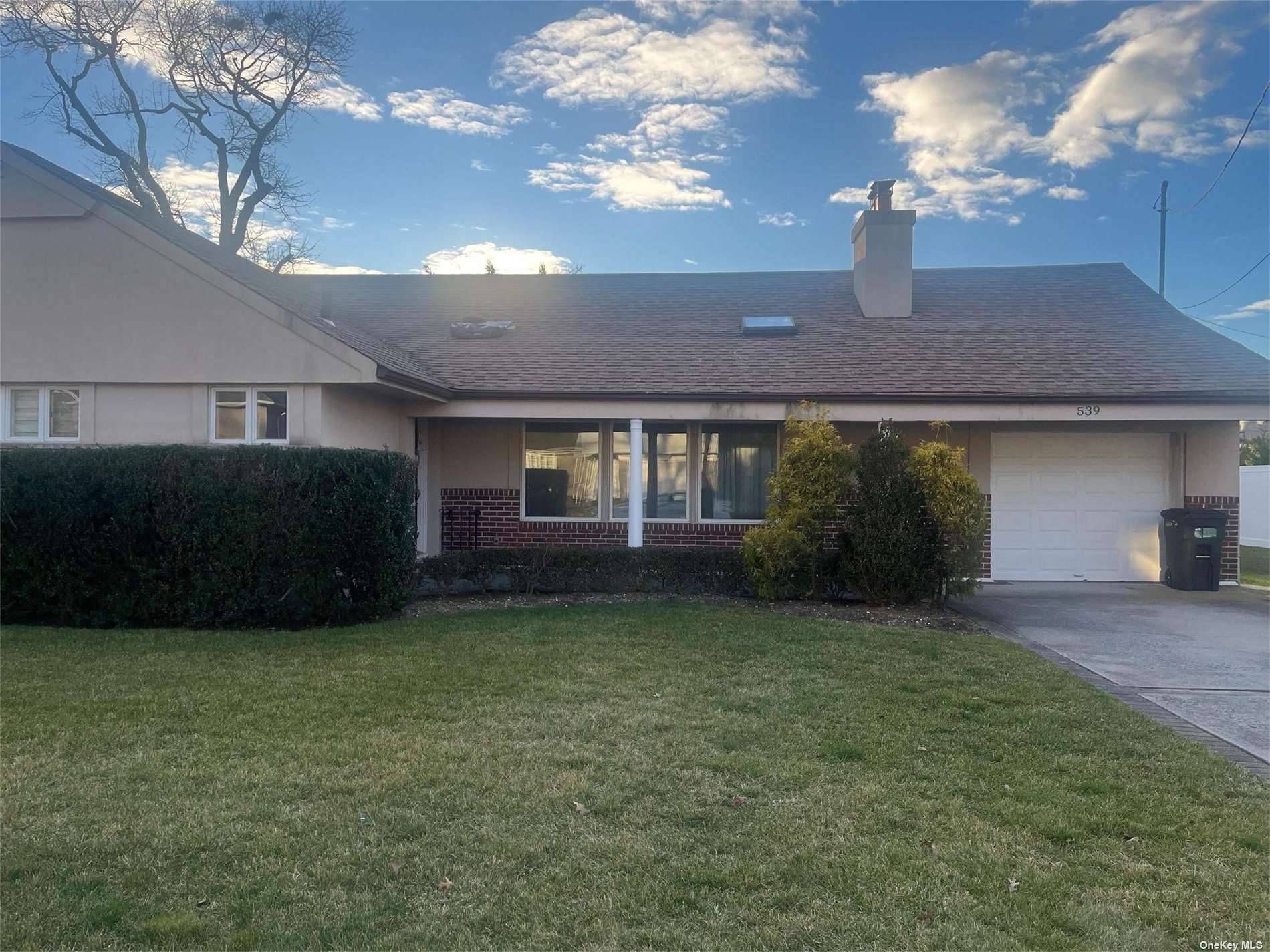 Explore this inviting ranch in a coveted WOODMERE locale, boasting four bedrooms, two full baths, and central air conditioning.