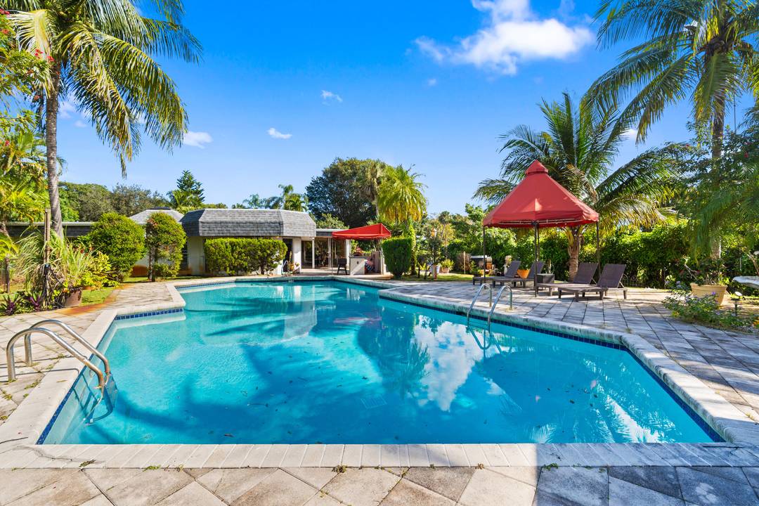 One of the last ''giant'' Mansions, located in the most desirable part of Tamarac, The Woodlands, where several neighboring properties recently sold for record prices between 1, 5 Million and ...