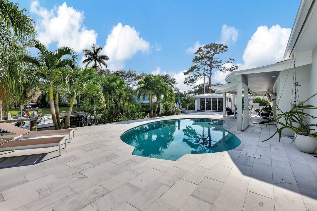 Stunning Fully Remodeled Waterfront Home with Private Dock and Ocean Access in Port Salerno Waterfront District.
