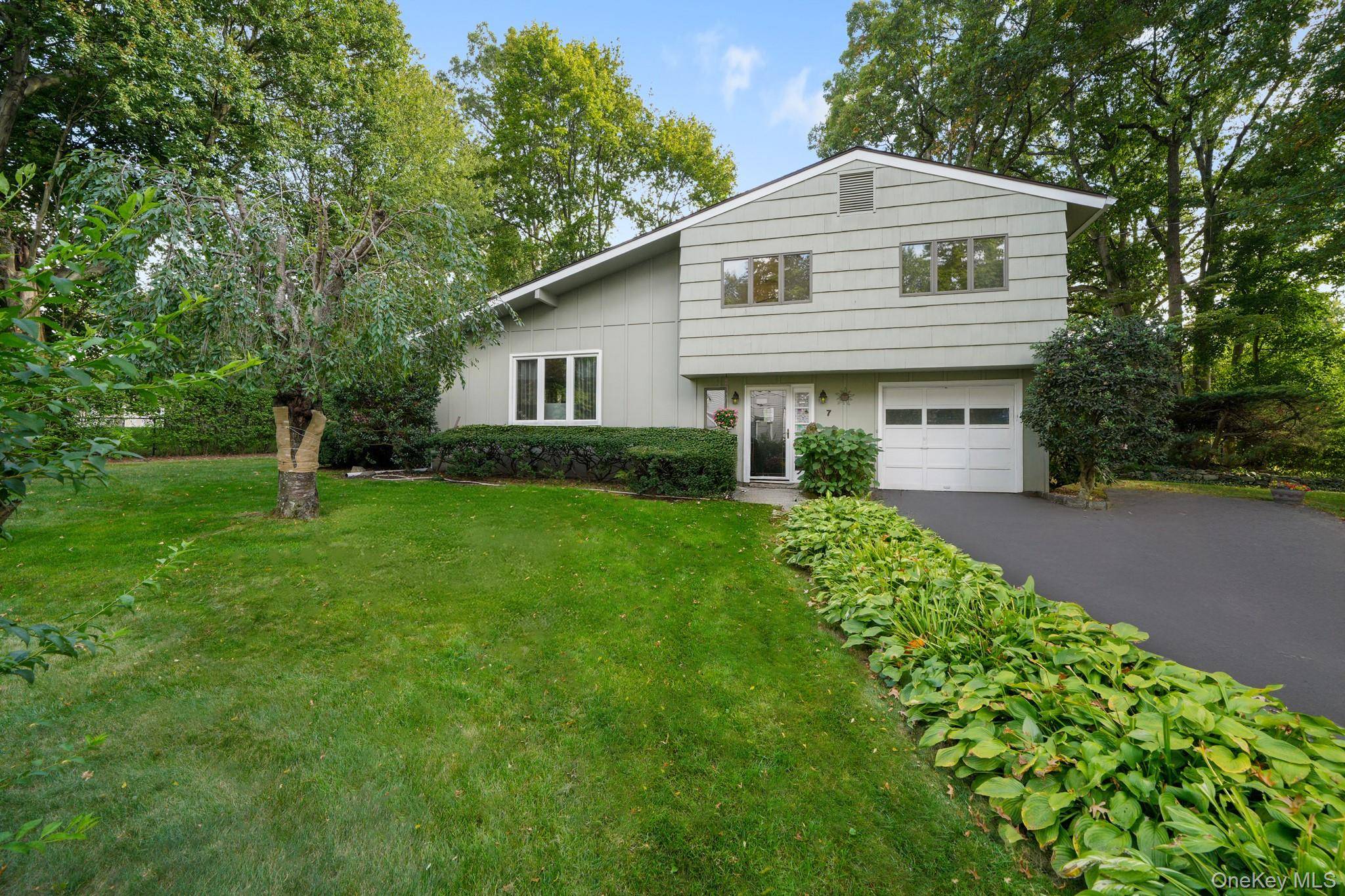 Welcome to this charming split level home nestled at the end of a peaceful cul de sac on a beautifully level lot.