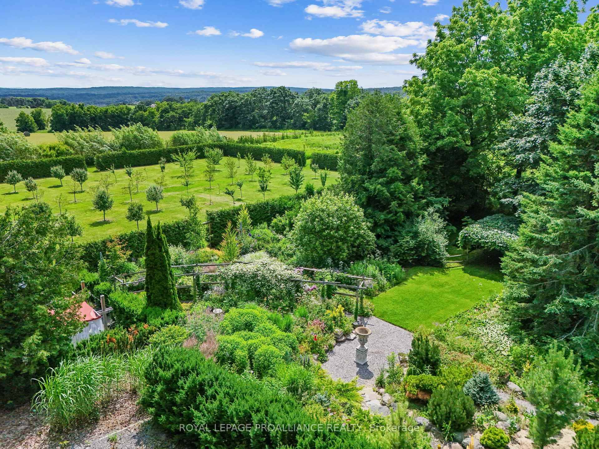 Experience the charm of this exceptional English inspired country estate, just 1.
