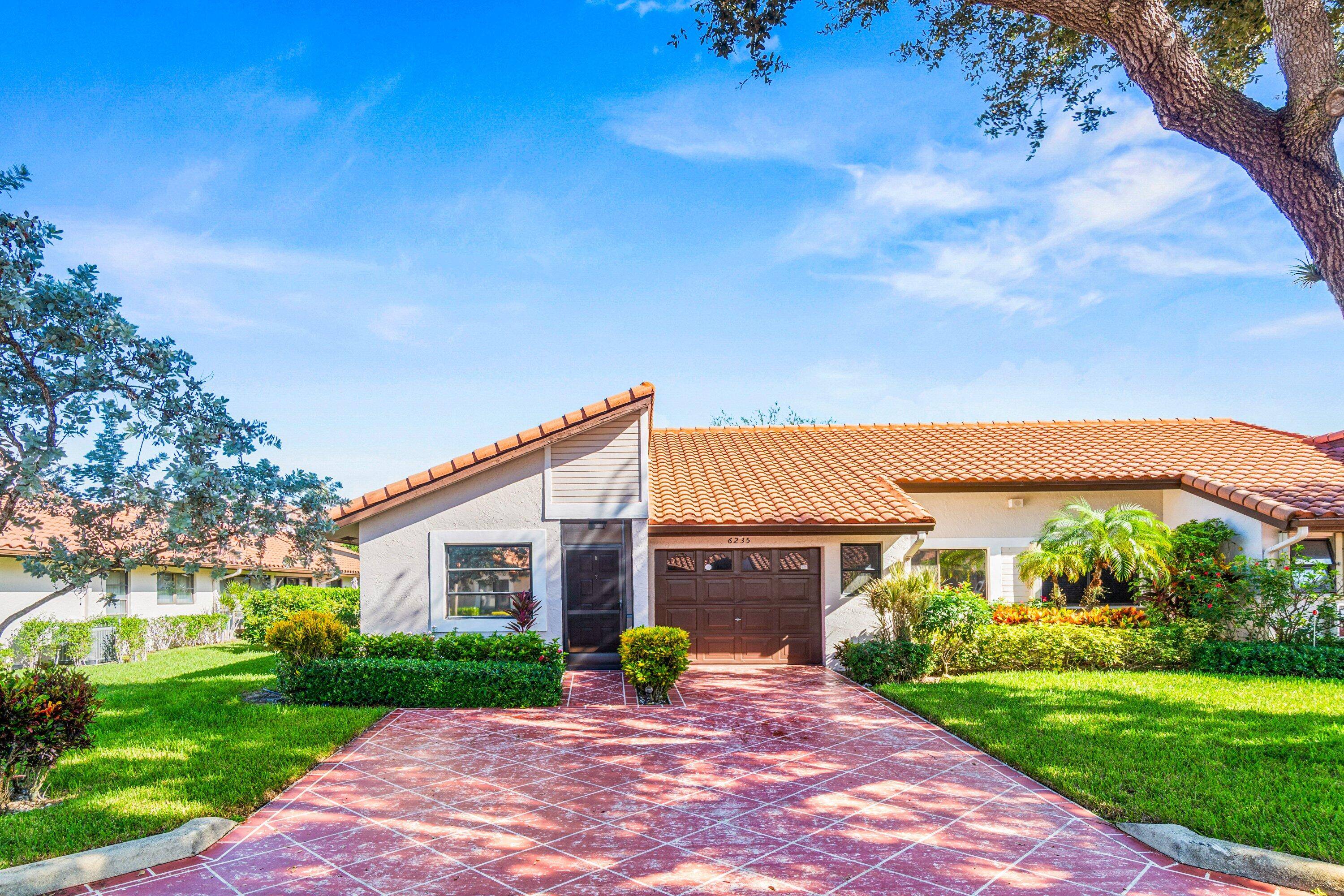 Discover modern living at 6235 Kings Gate Circle where comfort meets convenience in this corner villa.