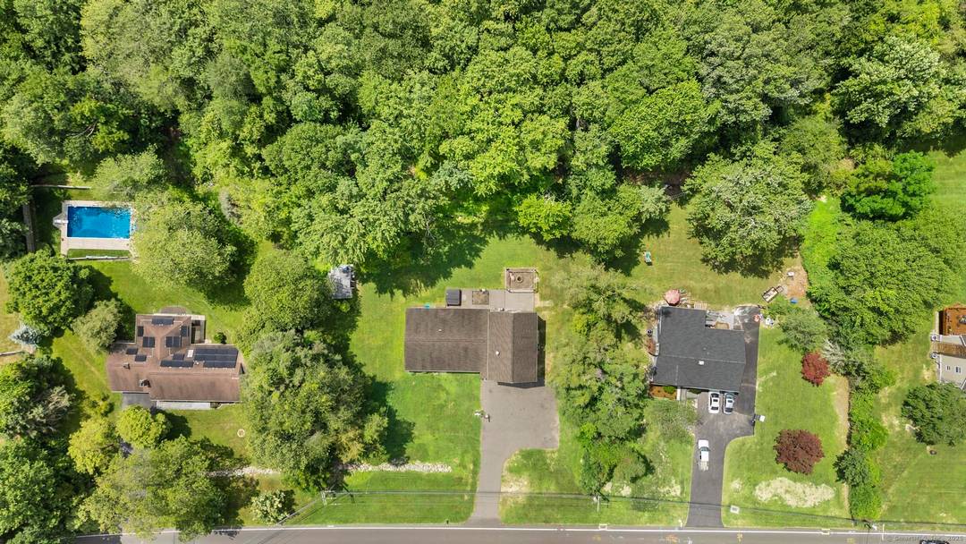 This spacious 6 bedroom, 4 bath single family home at 4809 Madison Ave, Trumbull, CT offers over 3, 400 sq ft of updated living space on a private 1.