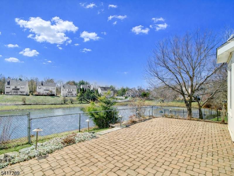 Bright, beautifully updated colonial available for rent at the end of a quiet cul de sac, offering picturesque pond views with fountains and evening lights.