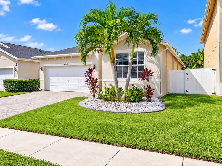 Spacious 4 bedroom, 2 bathroom SMART home with a PRIVATE SALTWATER POOL and fully fenced backyard in the desirable Auburn Park community of Lake Worth !