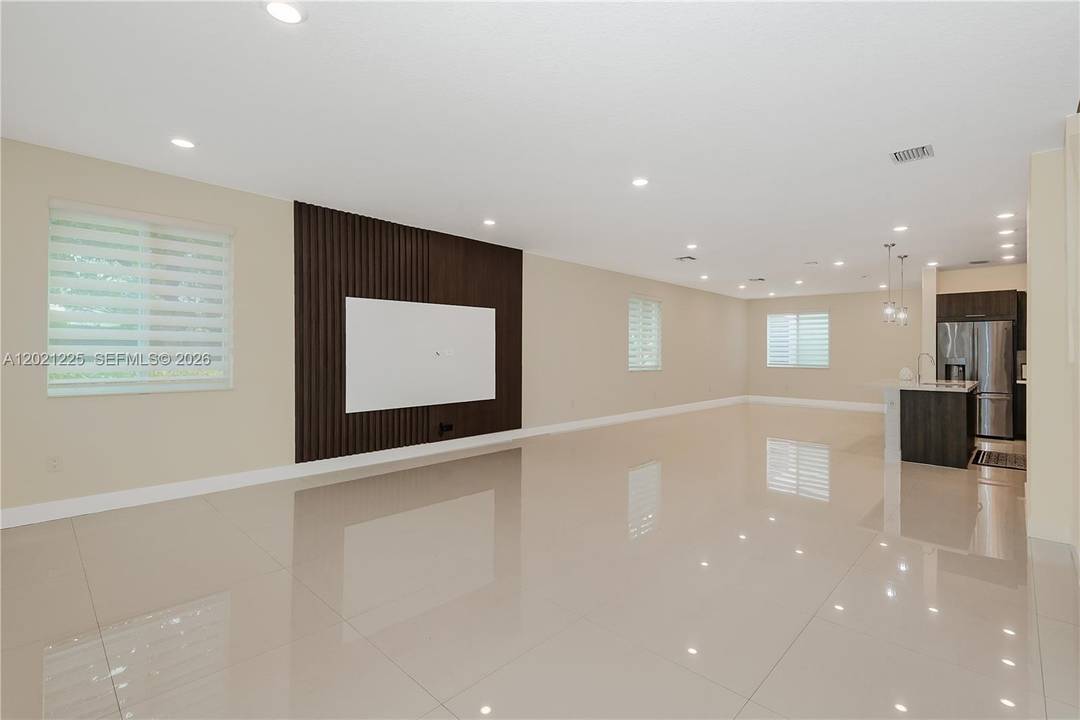 Modern corner townhouse with private NEXT GEN studio in highly sought after Landmark at Doral.