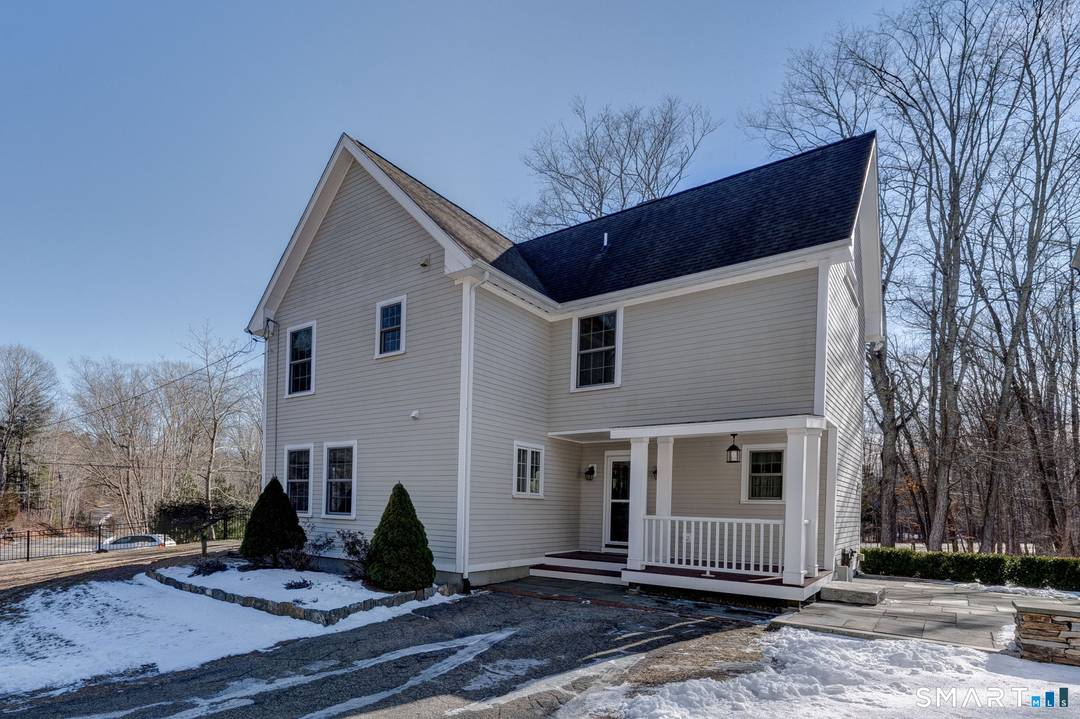 Welcome to 353 Warrenville Rd, a beautifully rebuilt 2008 3 bedroom, 2 full bath home that perfectly blends modern updates with classic New England charm.