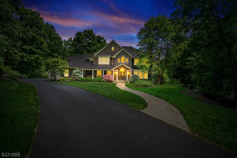 Set at the end of a picturesque cul de sac in prestigious Ridge Run, this stunning estate enjoys an unrivaled setting on 3 secluded acres adjoining protected Green Acres land.