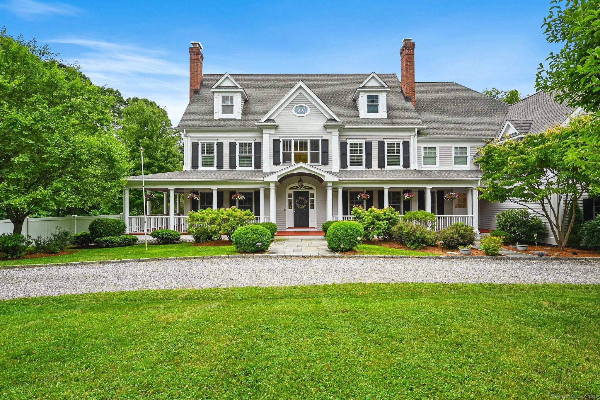 Welcome to your grand private estate set on a South Wilton cul de sac.
