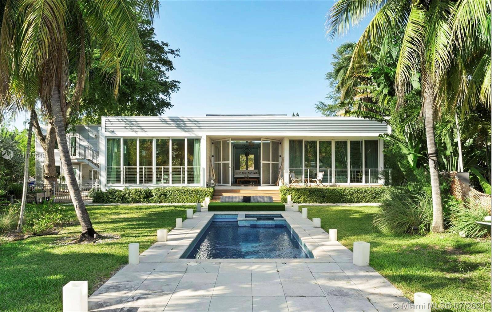 Your lucky find a modern waterfront pool house built in 2017 on a lushly landscaped oversized lot.