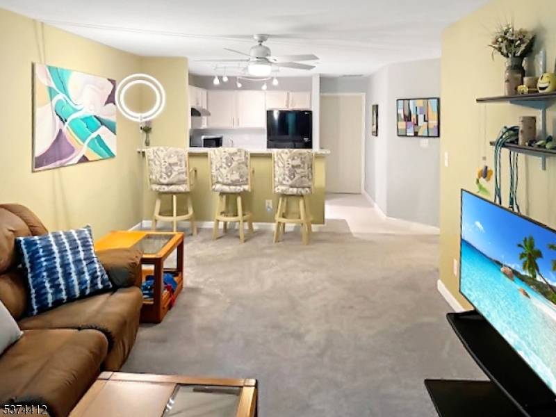Remarkable Updated First floor End unit in Willow Walk features 1 Bedroom with a Den and oversize garage.