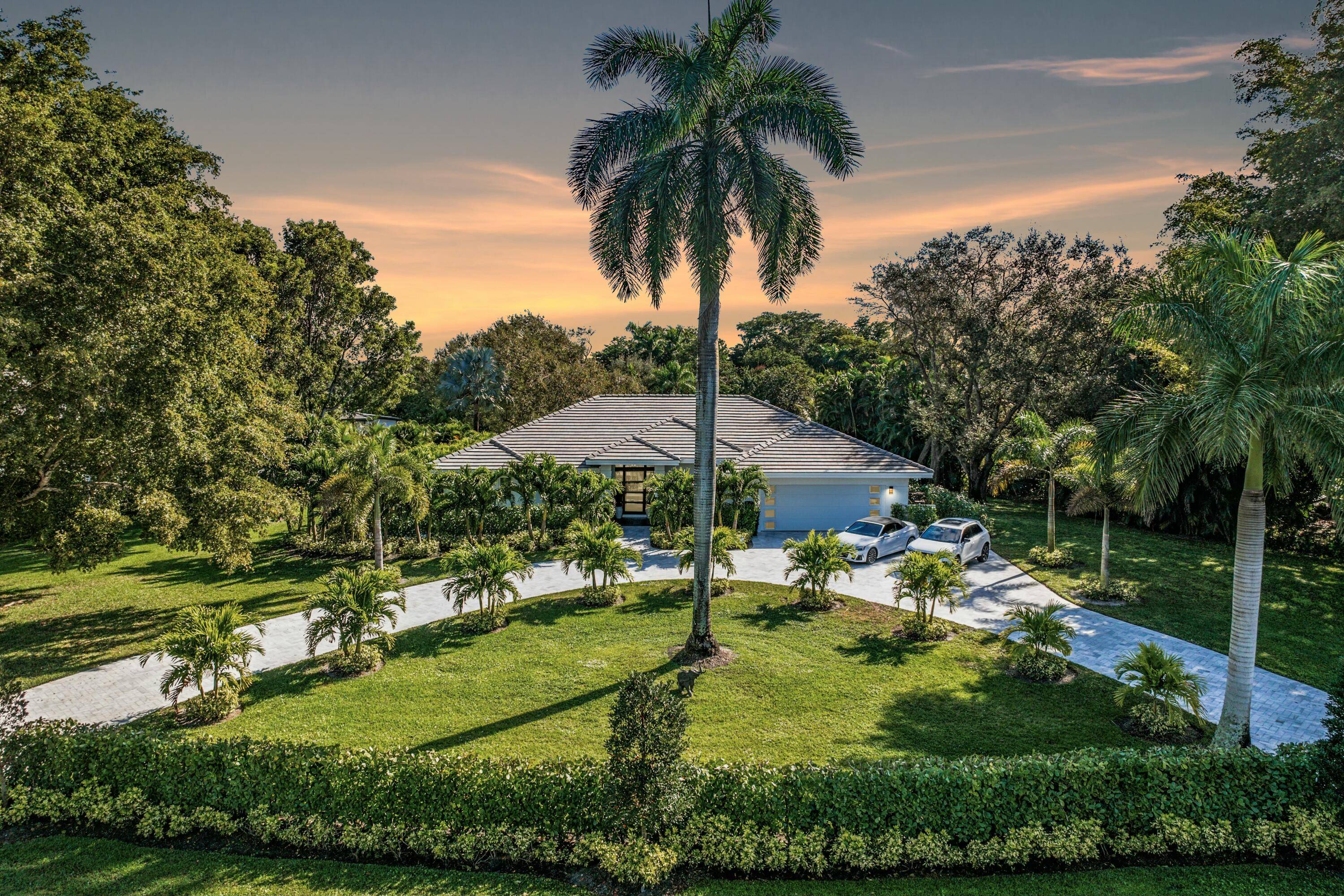 Nestled on a private one acre lot behind the gates of an exclusive community, Delray Lakes Estates, this stunning lakefront 3 bedroom, 3 bathroom home has been completely rebuilt from ...