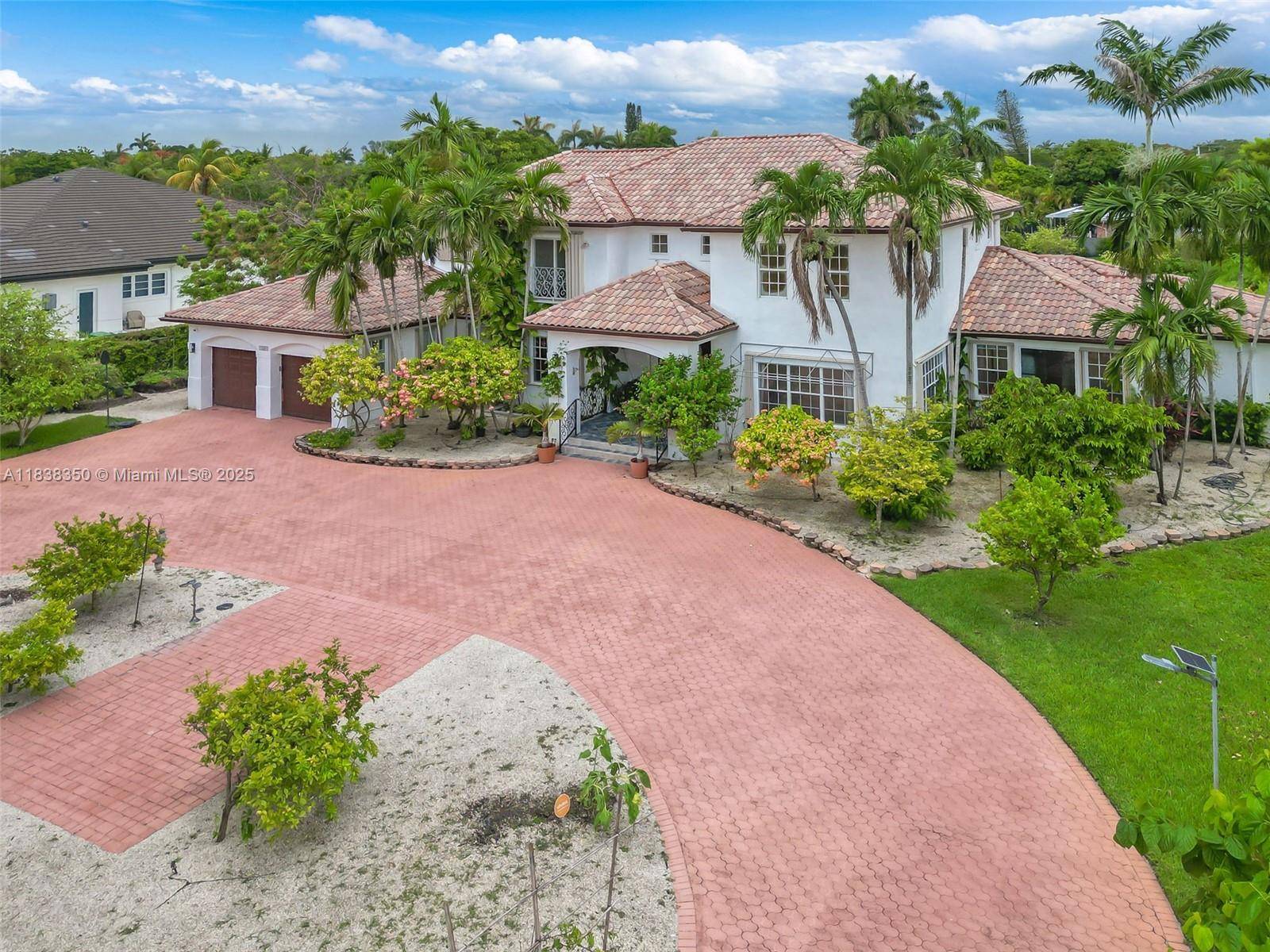 Beautifully maintained home on a corner lot over 1 Acre.