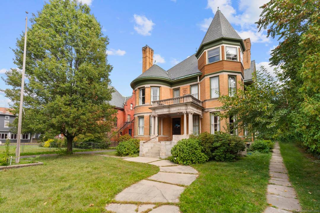 Welcome to 14 Wethersfield Avenue, an impressive mixed use 7, 188 SF brick Victorian set on a.