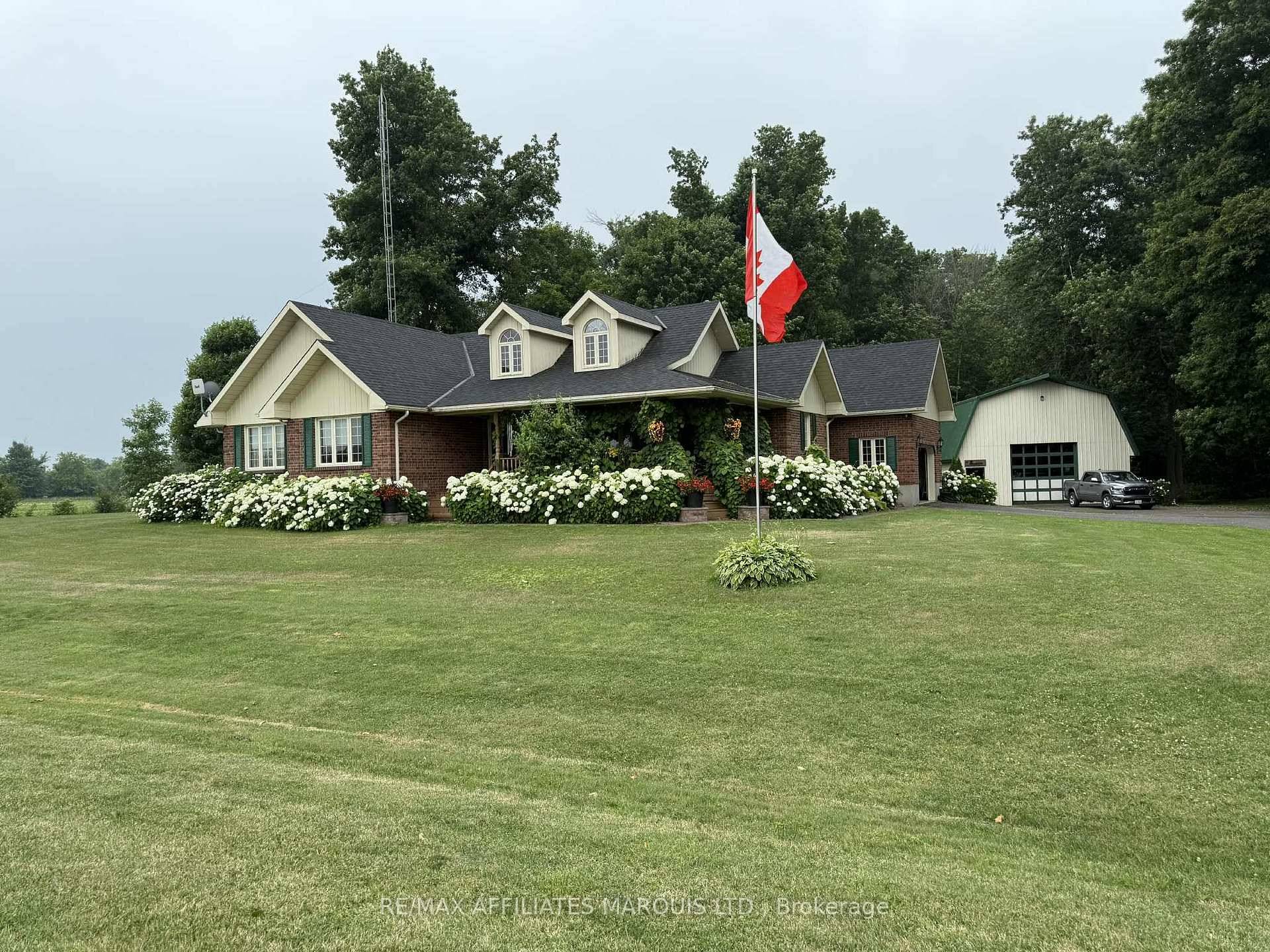 Set on a peaceful 1. 7 acre lot surrounded by nature, this custom built brick bungalow offers the kind of privacy and serenity only country living can provide.