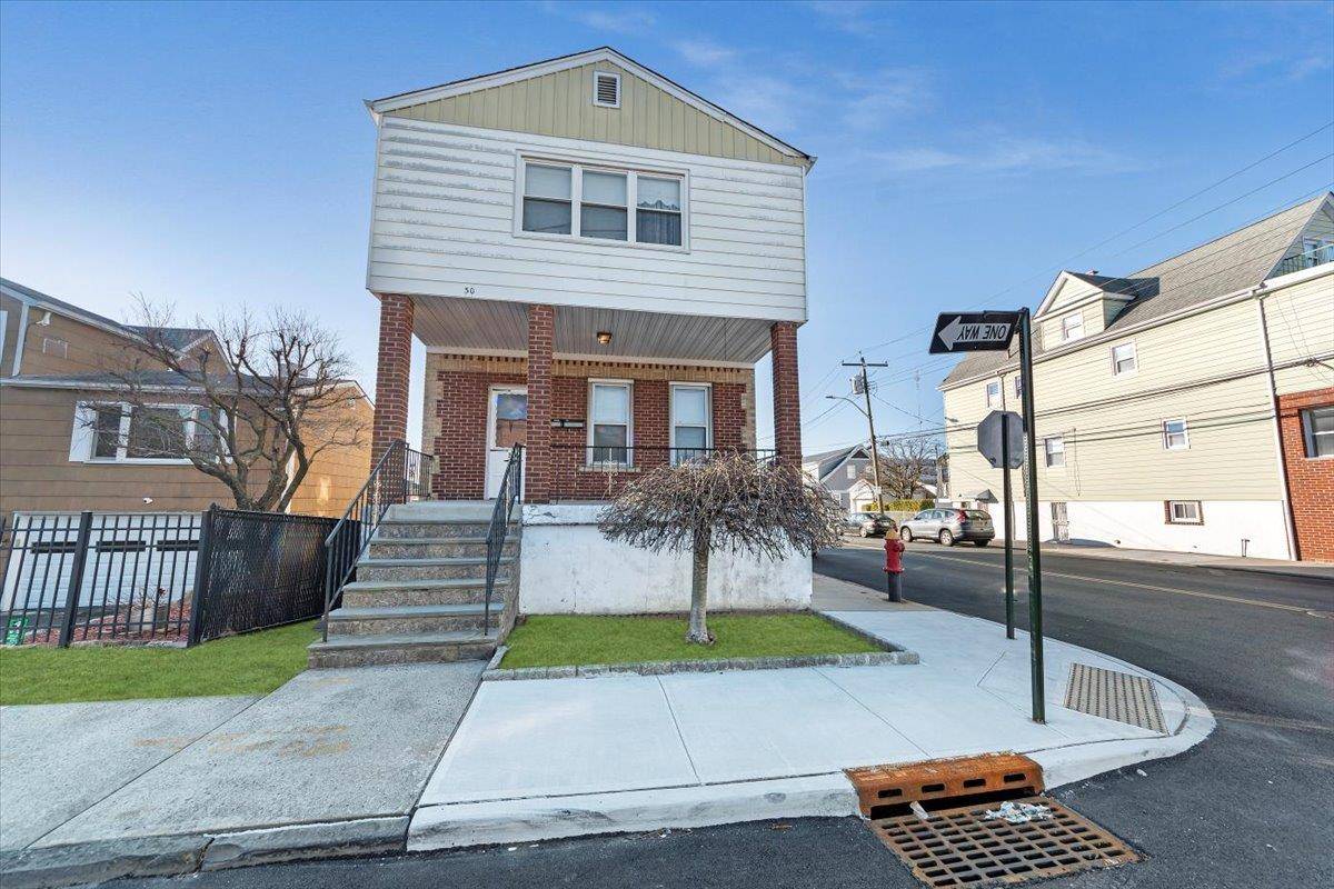 Charming Two Family Home in The Dunwoodie neighborhood.
