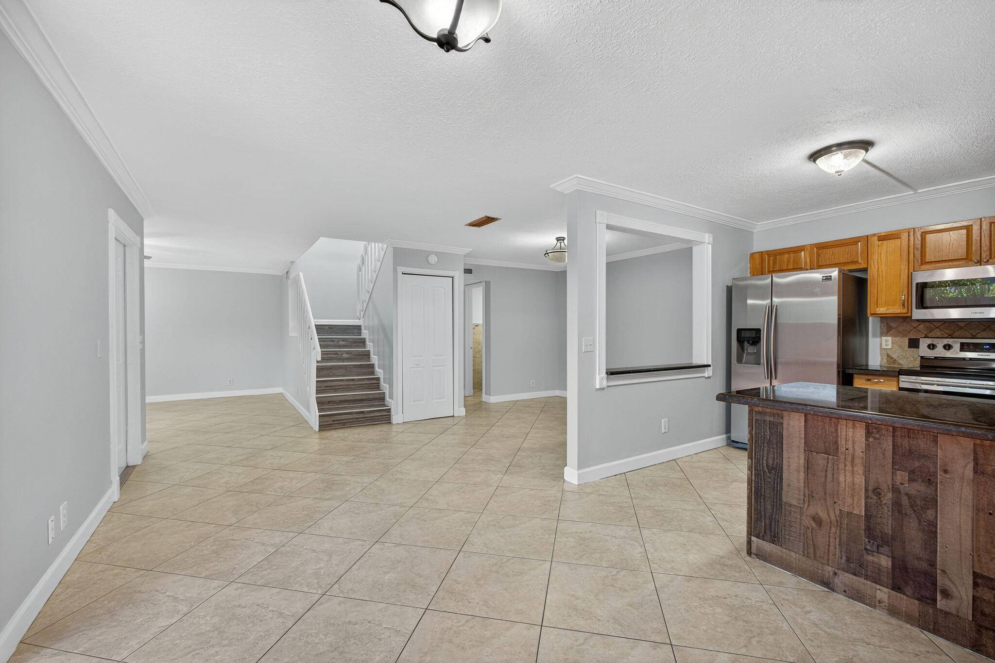 GORGEOUS 3 bedroom, 2. 5 bathroom RENOVATED townhome nestled in the vibrant heart of West Palm Beach with a NEW ROOF, New FRONT DOOR and Newer A C 2023.