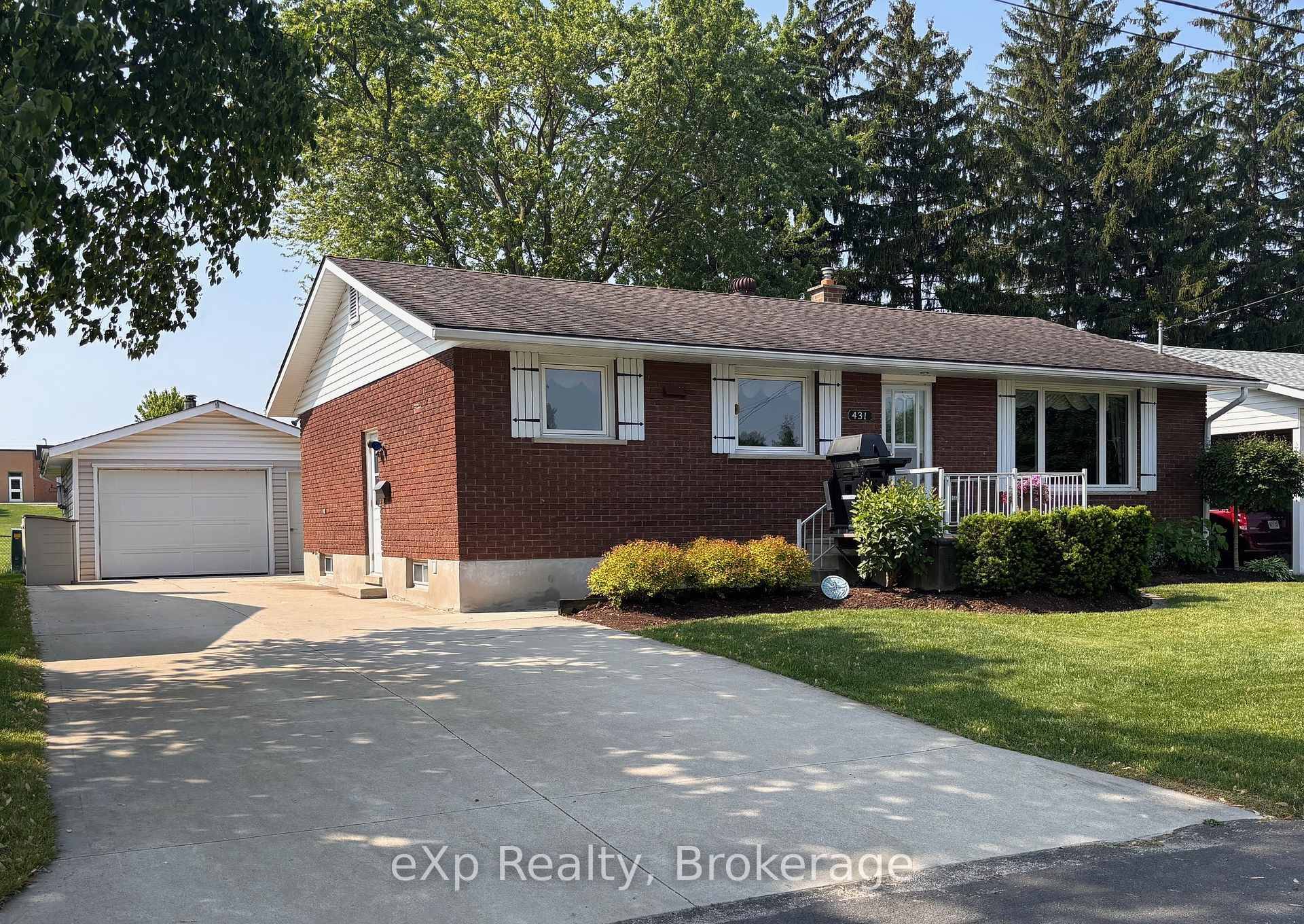 This neat and tidy brick bungalow sits proudly on a quiet, extra wide residential street in a desirable area of Town.