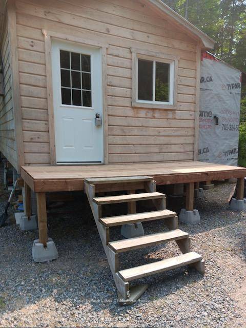 Come and see this charming 500 square foot home which is located in an all season, off grid Tiny Home community near South River.
