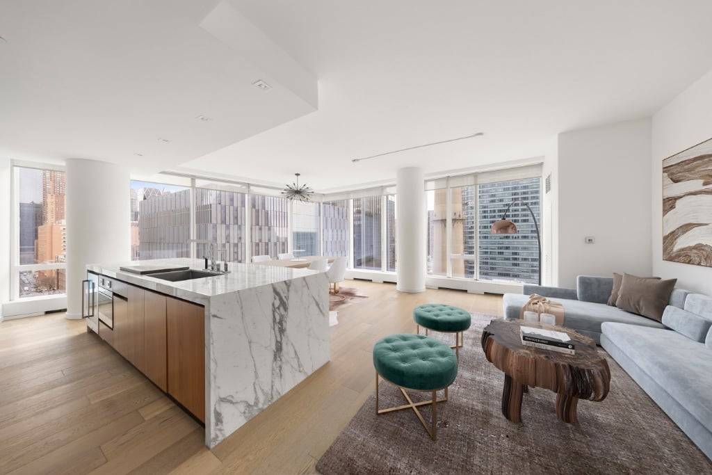 Nestled in a pristine corner, this two bedroom, two and a half bathroom apartment offers breathtaking views of the river and iconic midtown buildings.