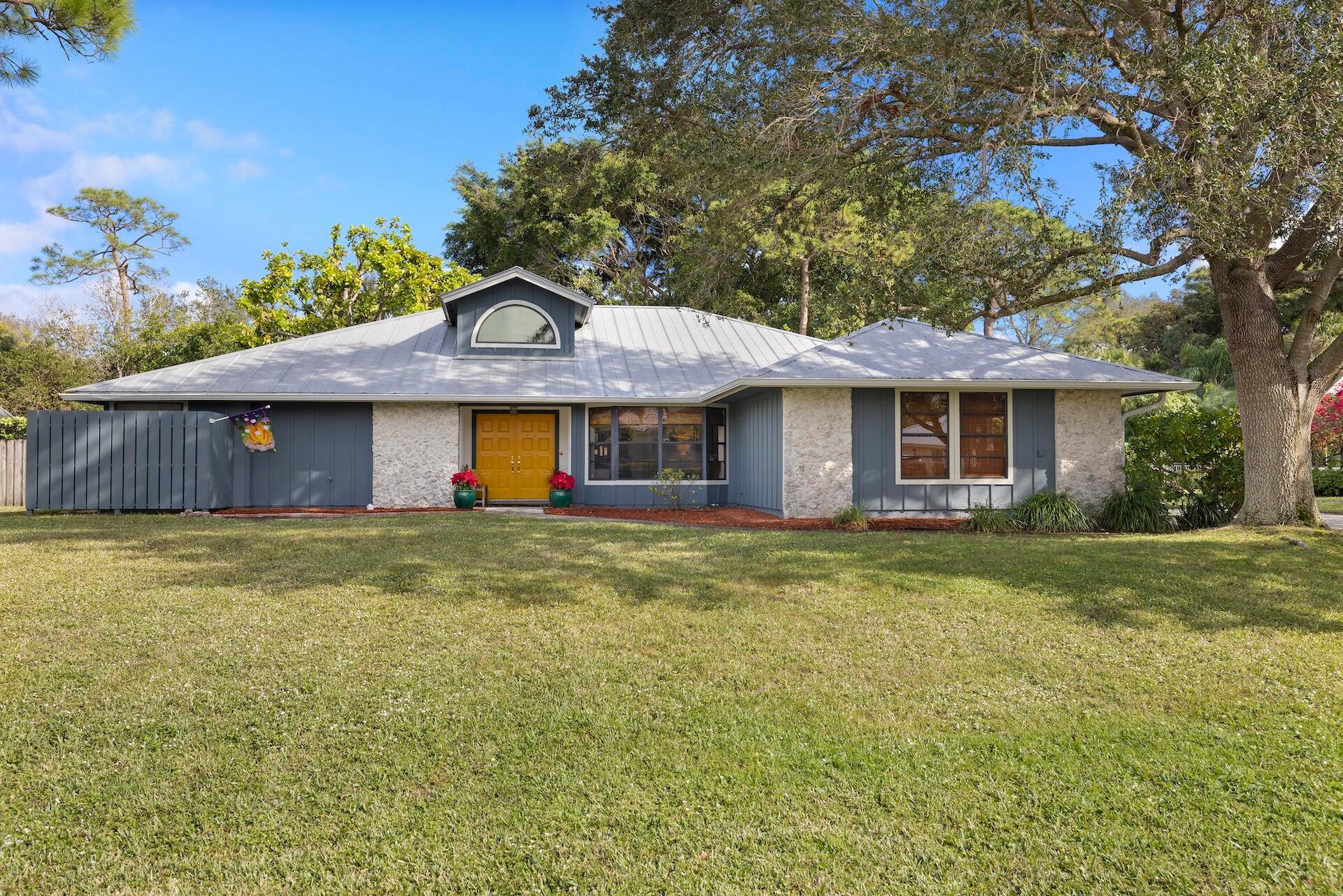NEW PRICE ! ! ! Don't miss the chance to transform this beautiful canvas into your dream home on a serene HALF ACRE LOT in Jupiter.