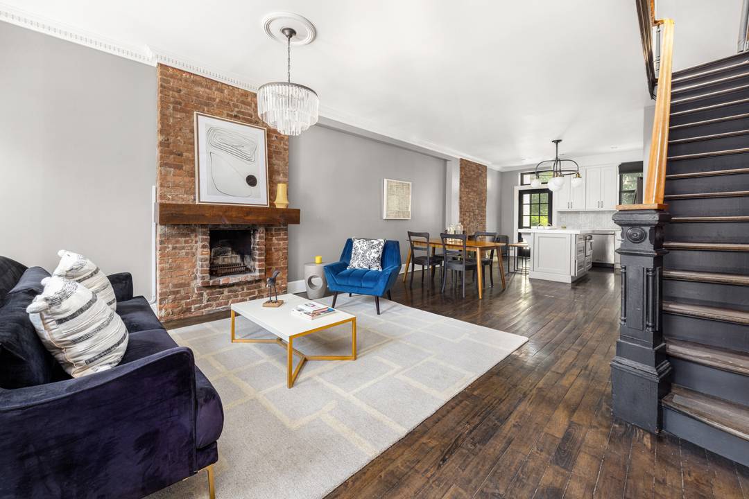 Timeless Sophistication on Garfield Place Discover the perfect harmony of historic character and modern refinement in this impeccably preserved two family brick townhouse.