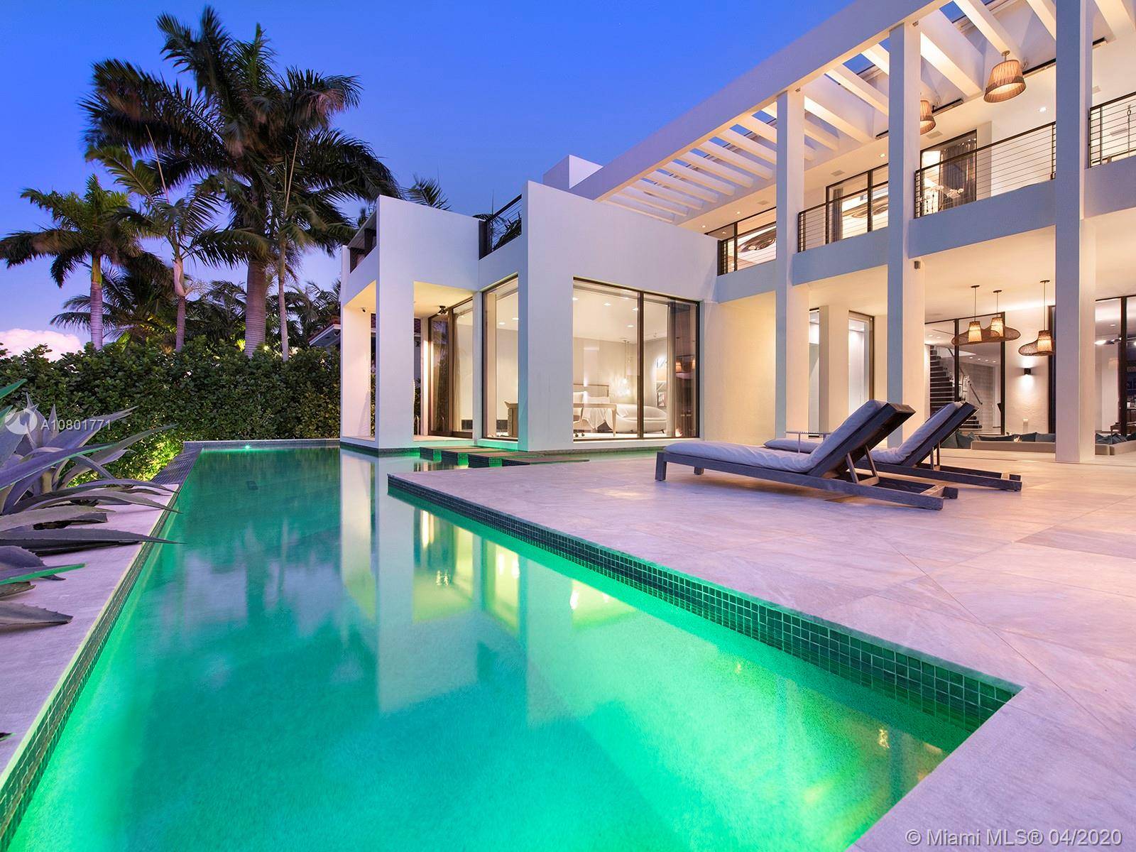Inspired by a Boheme Design, this marvelous waterfront home sits on an extra large 12, 250 SF lot with spectacular wide bay views to the north including warm, yet modern ...
